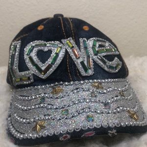 rhinestoned hat with the letters “love” engraved.